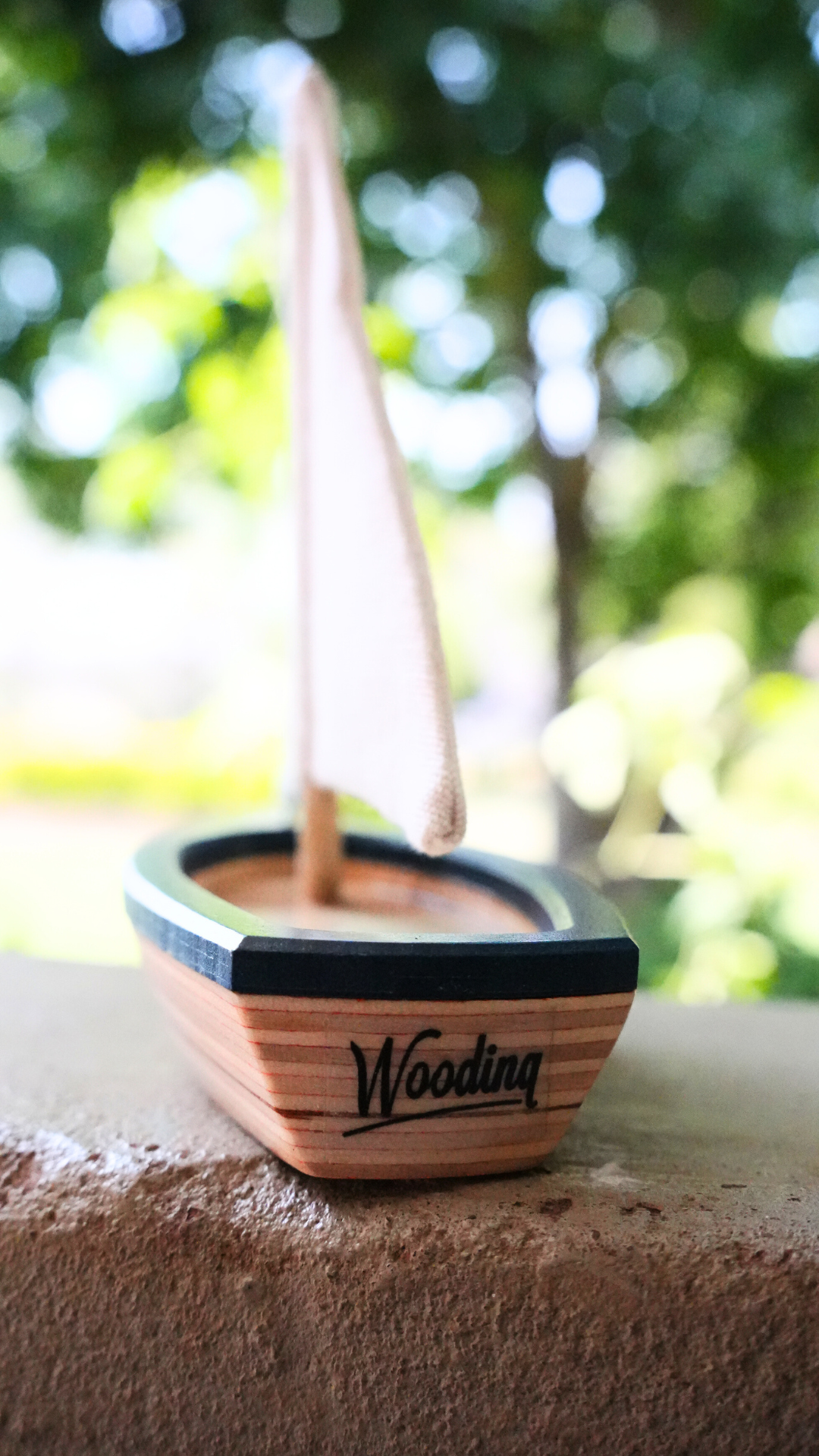 handcrafted wooden sailboat toy by Woodinq side view